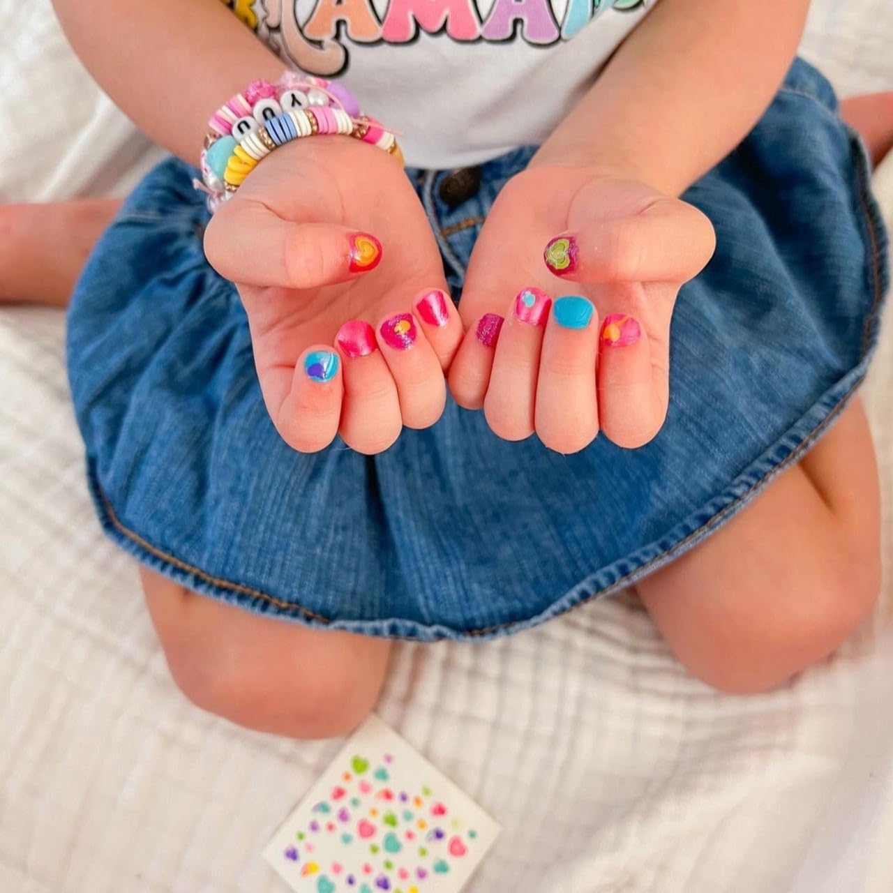Piggy Paint sweetie stickers angled to display colorful kid-friendly designs