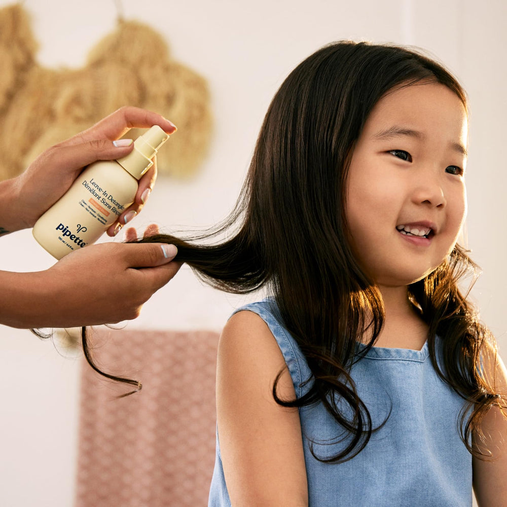 Parent using Pipette detangler on child showing reduced pulling and calmer combing