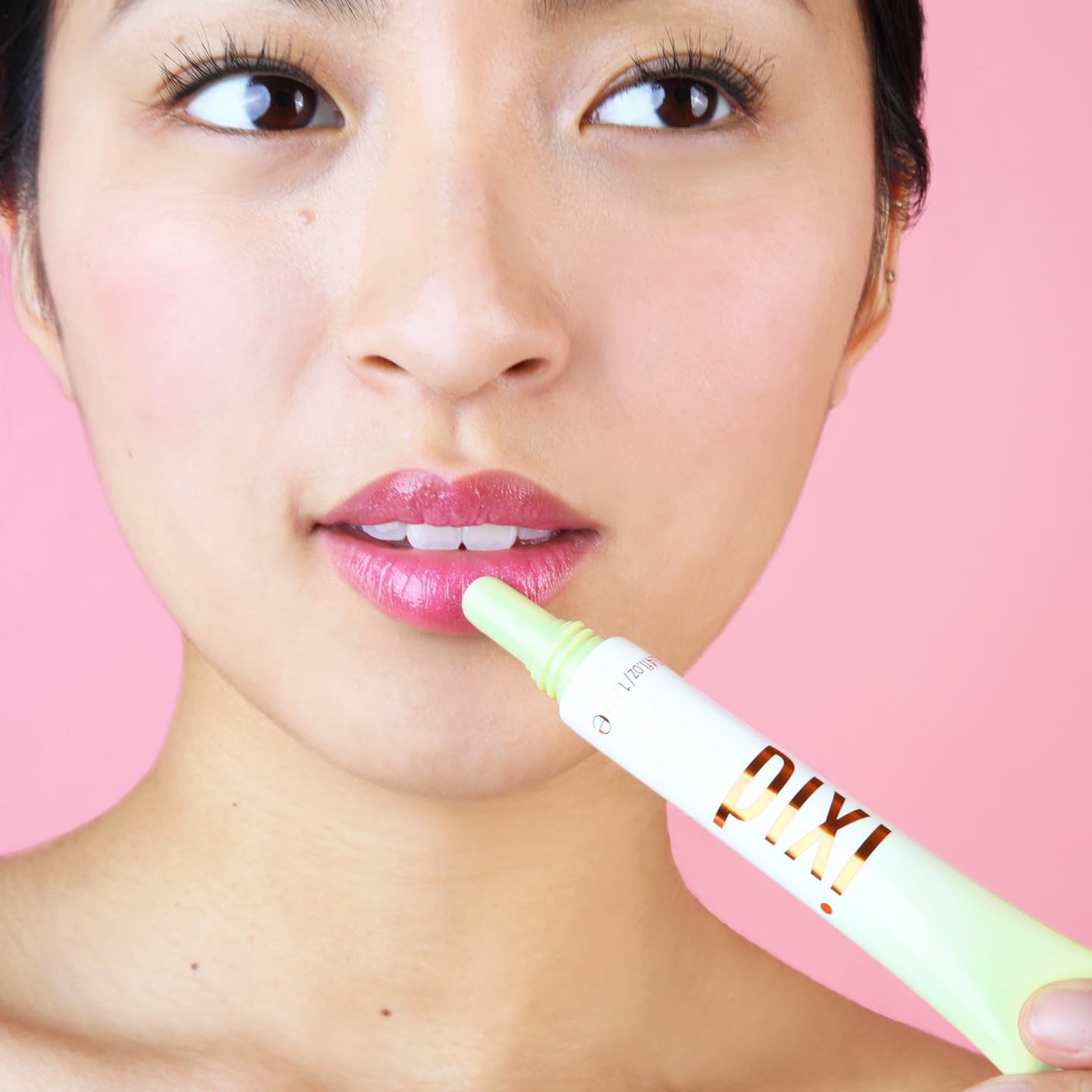 Pixi LipTone Naturalness tube beside rosehip and shea butter ingredients for nourishment