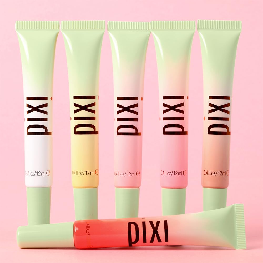 Pixi LipTone tube next to coin for scale emphasizing compact, travel-friendly size