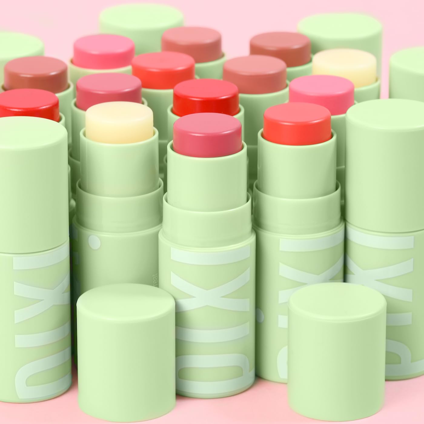 Pixi +Hydra LipTreat beside a makeup bag in a lifestyle scene suggesting daily carry convenience