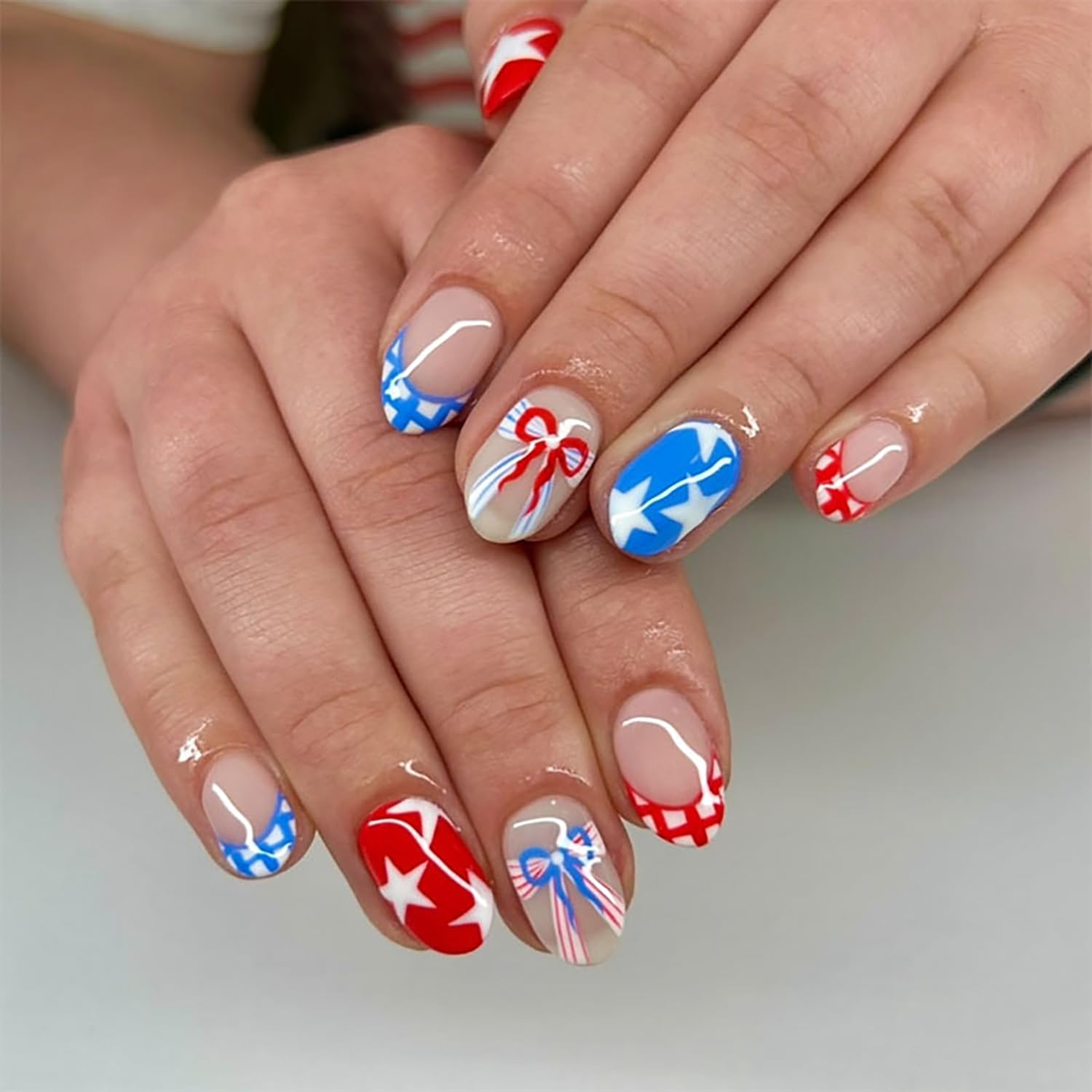 PODUOJIEYI front packaging showing 24 patriotic press-on nails and kit