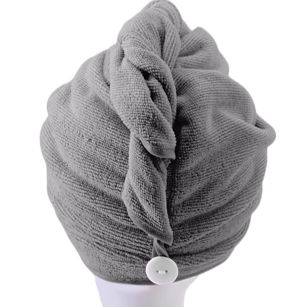 POLYTE model wearing turban in bathroom demonstrating secure hands-free use