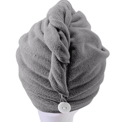 POLYTE model wearing turban in bathroom demonstrating secure hands-free use