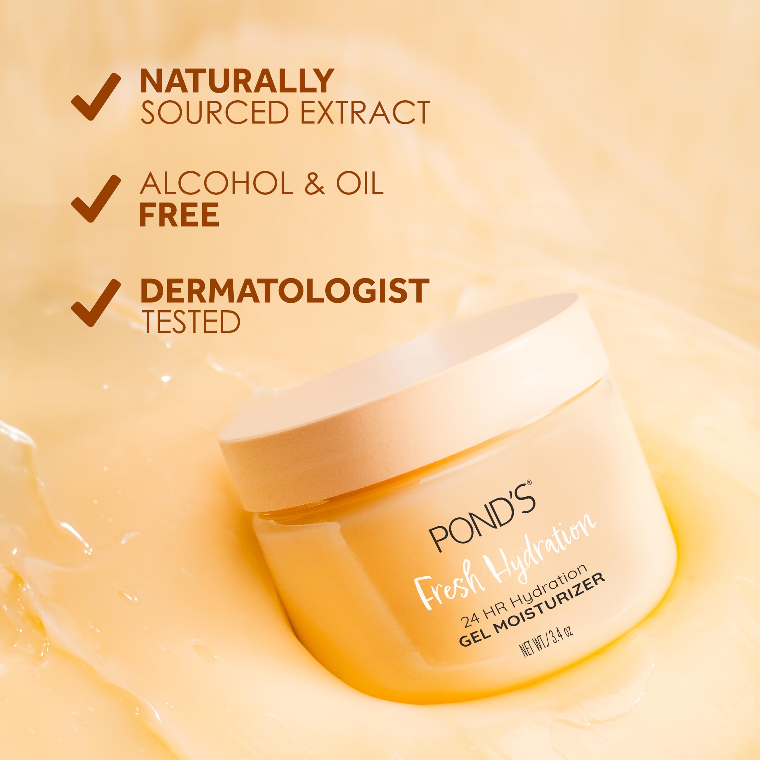 POND'S jar beside orange slice highlighting orange extract benefit