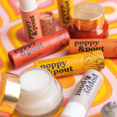 Poppy & Pout flatlay with blood orange and mint showing flavor inspiration benefit