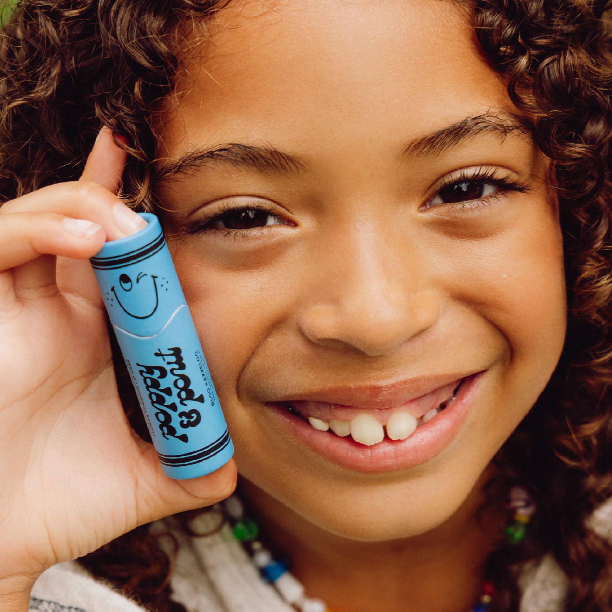 Poppy & Pout balm texture close-up showing smooth beeswax finish for long-lasting moisture