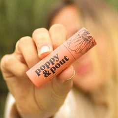 Poppy & Pout balm texture close-up showing smooth beeswax formula for lasting moisture