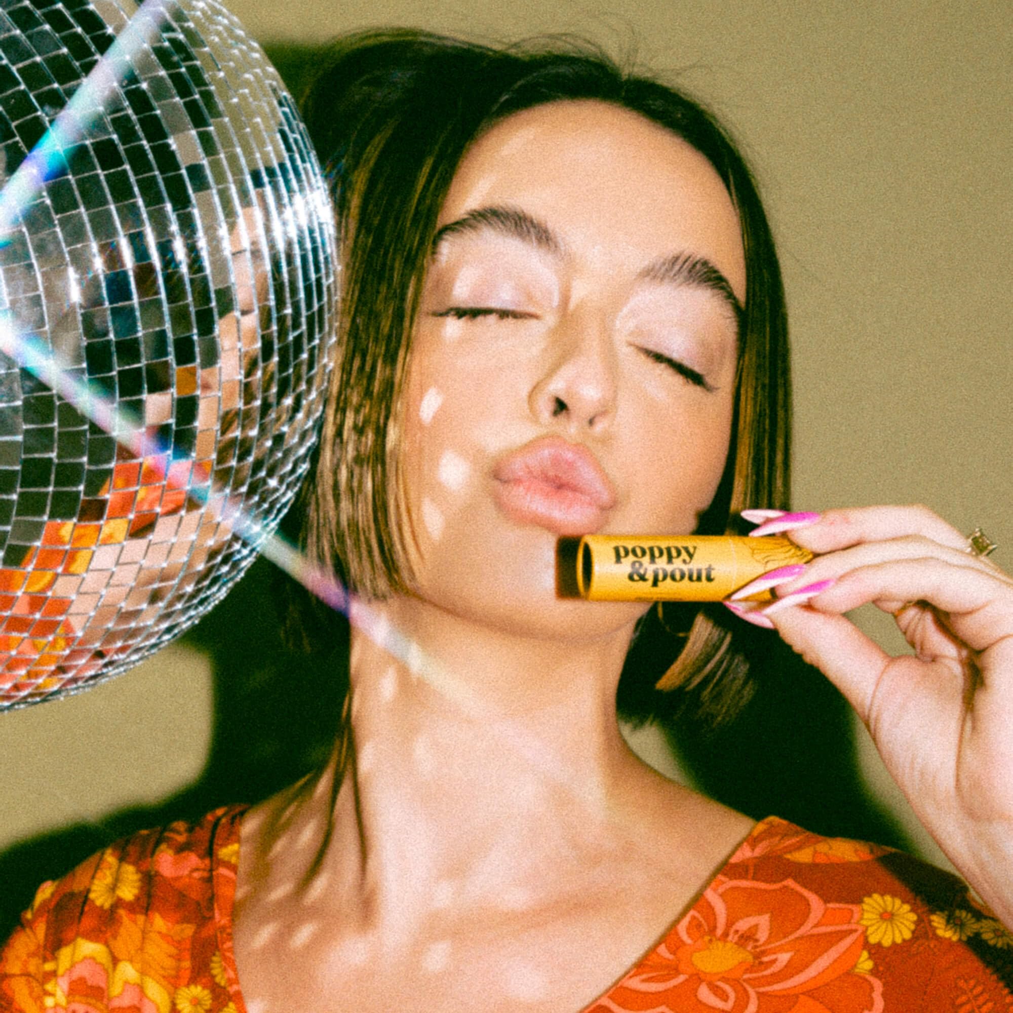Poppy & Pout lip application close-up illustrating smooth protective finish