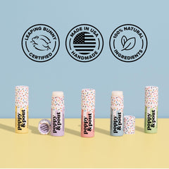 Poppy & Pout lip balm next to standard tube illustrating double product capacity