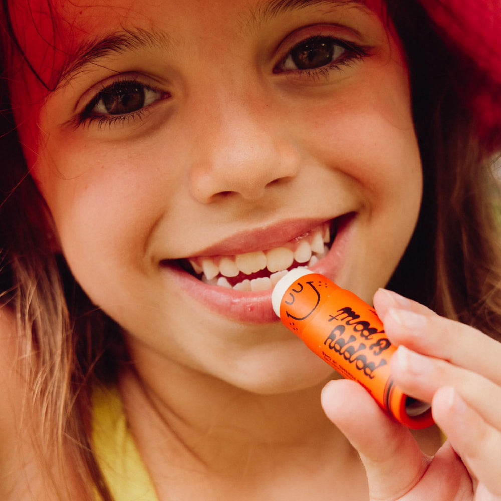 Poppy & Pout hand-pouring balm at Idaho facility emphasizing small-batch care