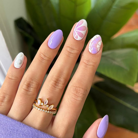 Posyofet close-up of glossy purple nail with flower design, highlights detailed finish