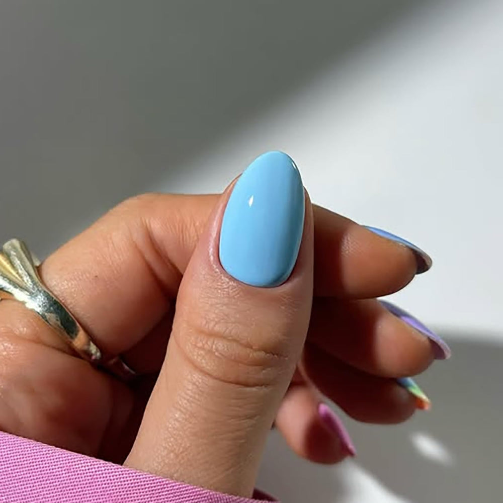 Posyofet worn on hand model displaying blue and pink set, instant polished look