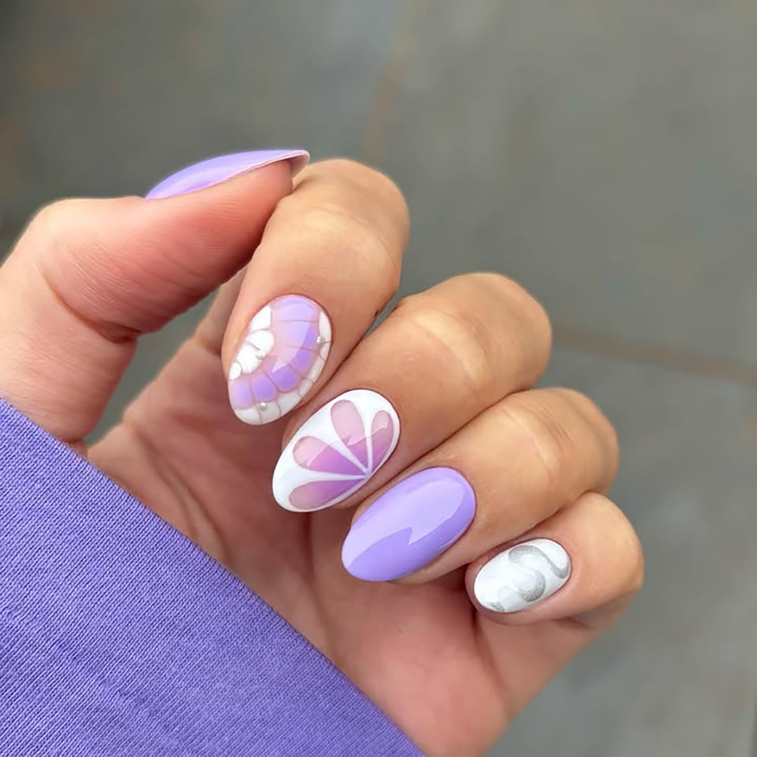 Posyofet side profile showing almond curve on a nail, demonstrates natural fit benefit