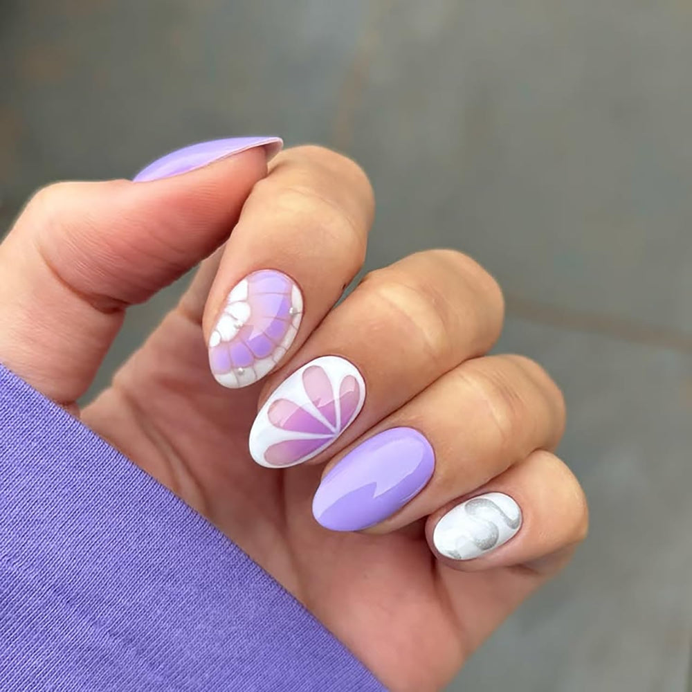 Posyofet side profile showing almond curve on a nail, demonstrates natural fit benefit