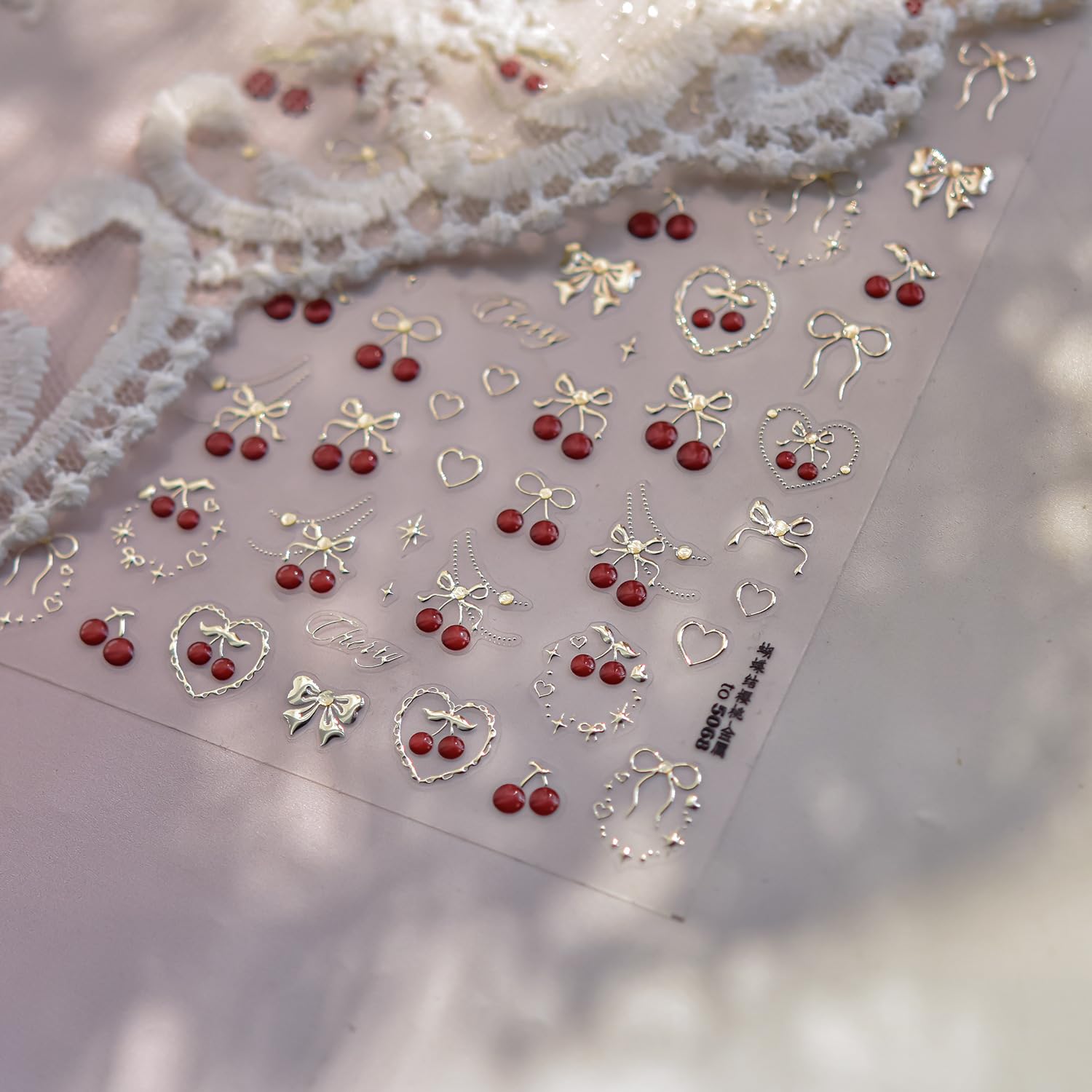 POWPOP close-up of embossed gold cherry detail adding luxe texture and shimmer