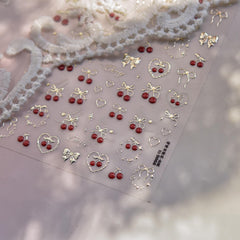 POWPOP close-up of embossed gold cherry detail adding luxe texture and shimmer