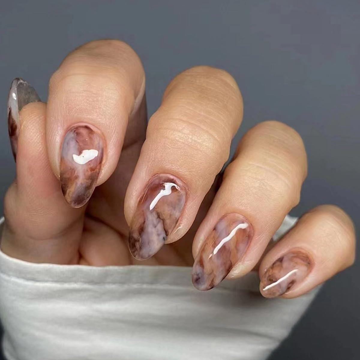 POWPOP fingernails in use at an event showing polished, camera-ready finish