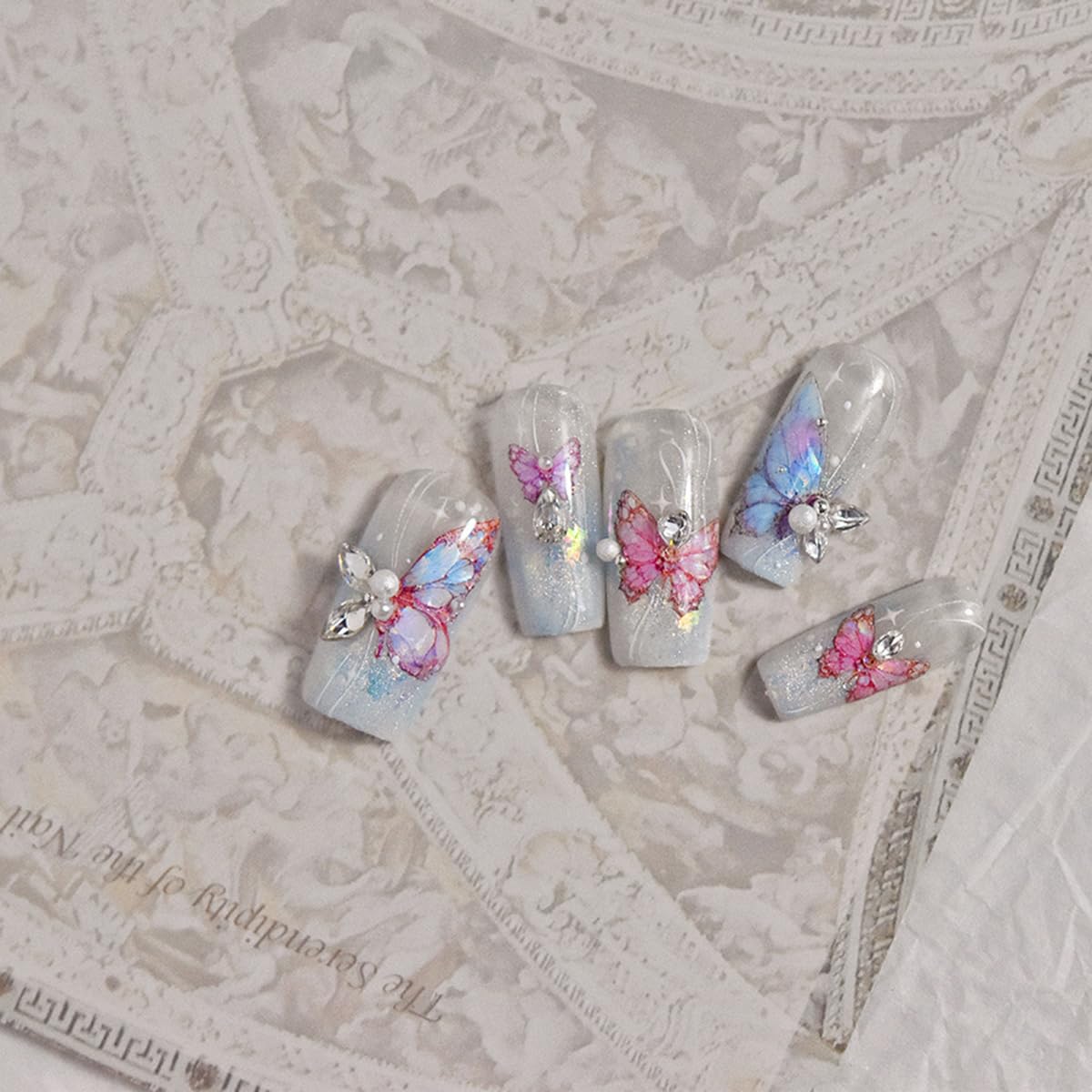 POWPOP lifestyle photo of summer manicure showcasing bright butterflies and style