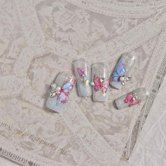 POWPOP lifestyle photo of summer manicure showcasing bright butterflies and style