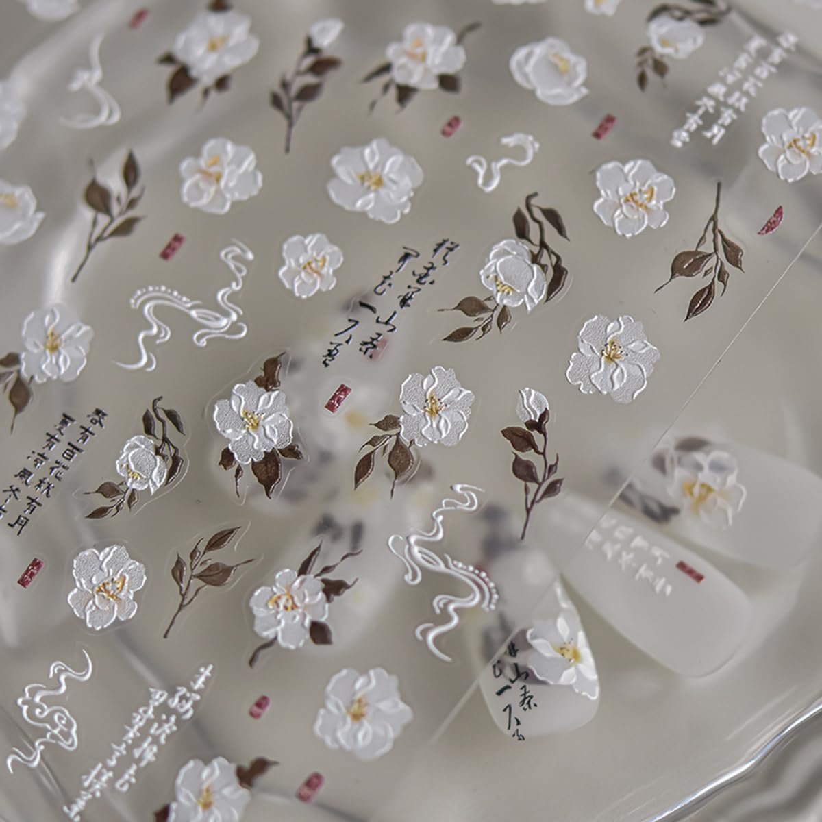 POWPOP stickers applied on French tips to add elegant floral accents