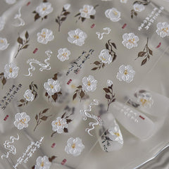 POWPOP stickers applied on French tips to add elegant floral accents