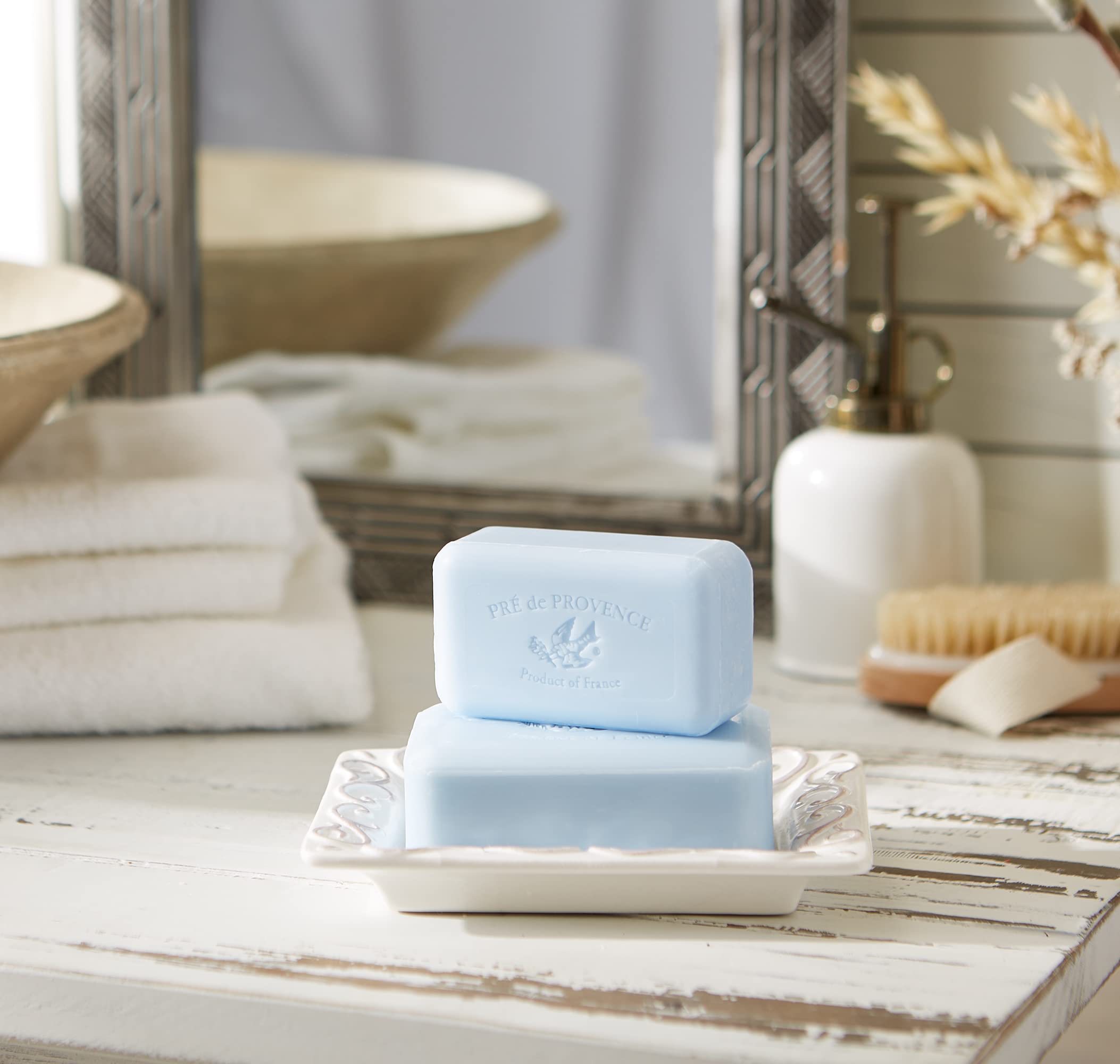 Pre de Provence bar next to a hand for scale showing generous 8.8 oz size