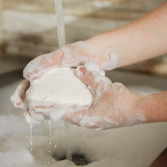 Pre de Provence soap texture close-up revealing smooth quad-milled surface for gentle cleansing