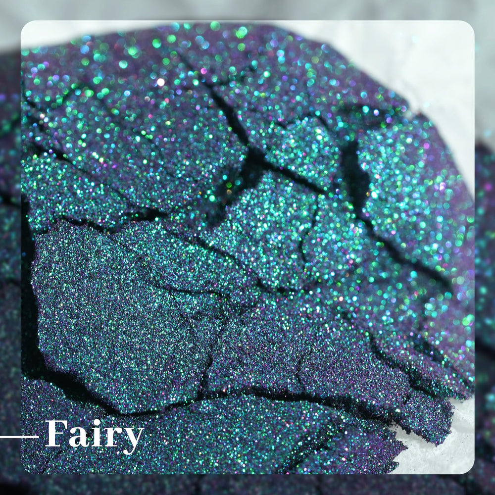 Pretty Diva powder on finished nail showing mirror finish and dramatic color shift