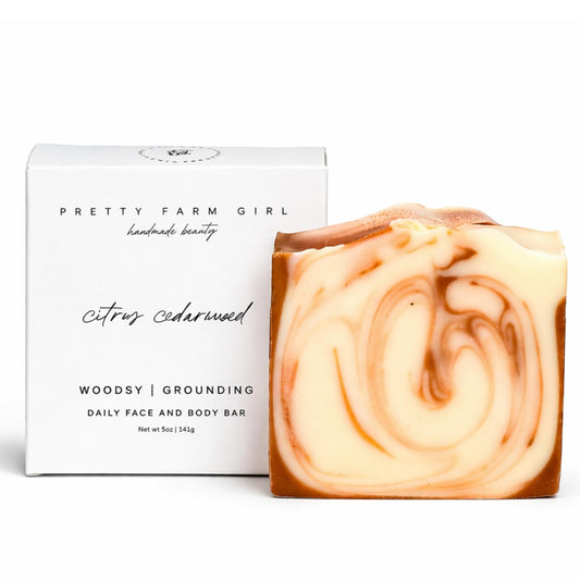Pretty farm girl front packaging shows citrus cedarwood label and eco benefit