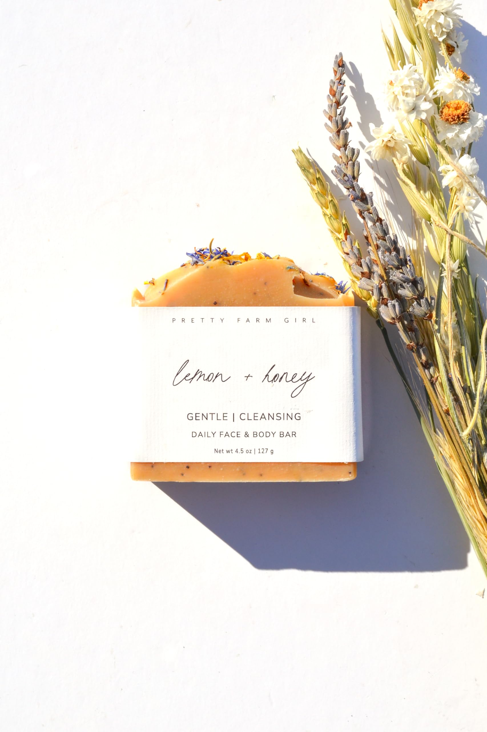 Pretty farm girl close-up of soap texture with visible poppy seeds for gentle exfoliation