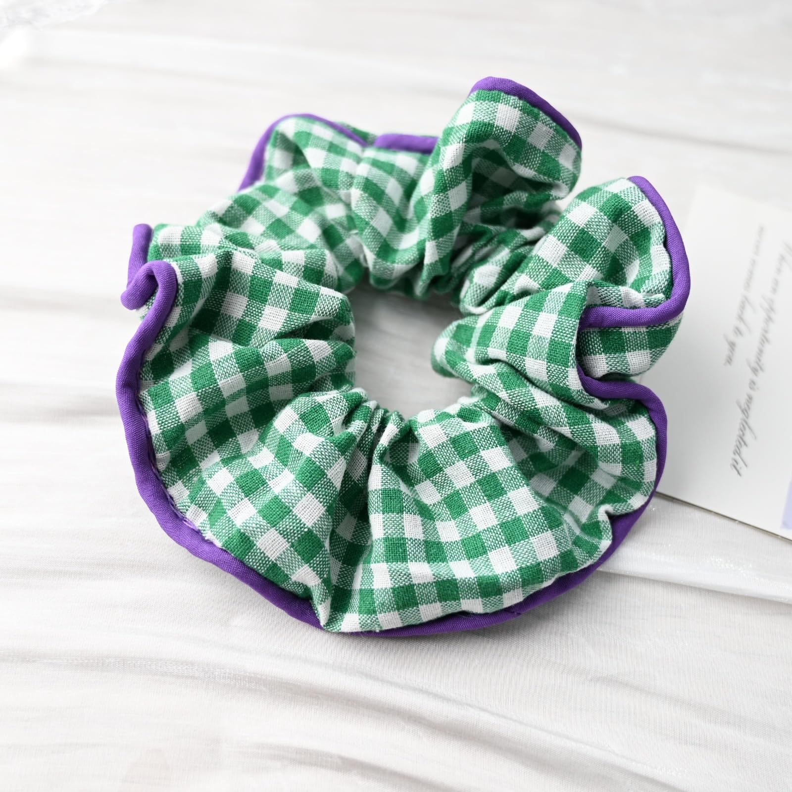Prettyou lifestyle bag shot showing scrunchie tucked into purse for on-the-go styling