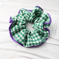 Prettyou lifestyle bag shot showing scrunchie tucked into purse for on-the-go styling