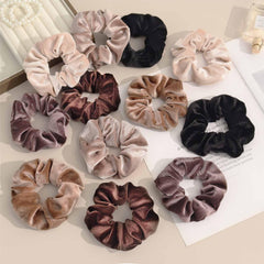 PROPOG scrunchie next to ruler showing 4.3-inch size and proper fit benefit