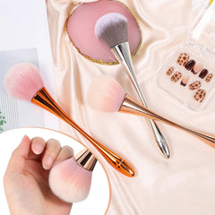 Psiriol brush held in hand to show compact size and comfortable control