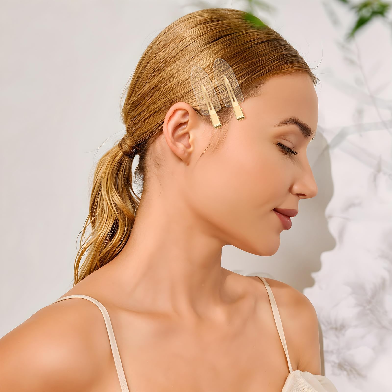 Psyqtsuary clip holding hair while applying makeup for crease-free benefit