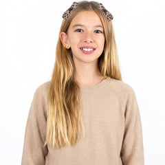 Ptwola bowknot in a ponytail showing decorative accent and secure fit