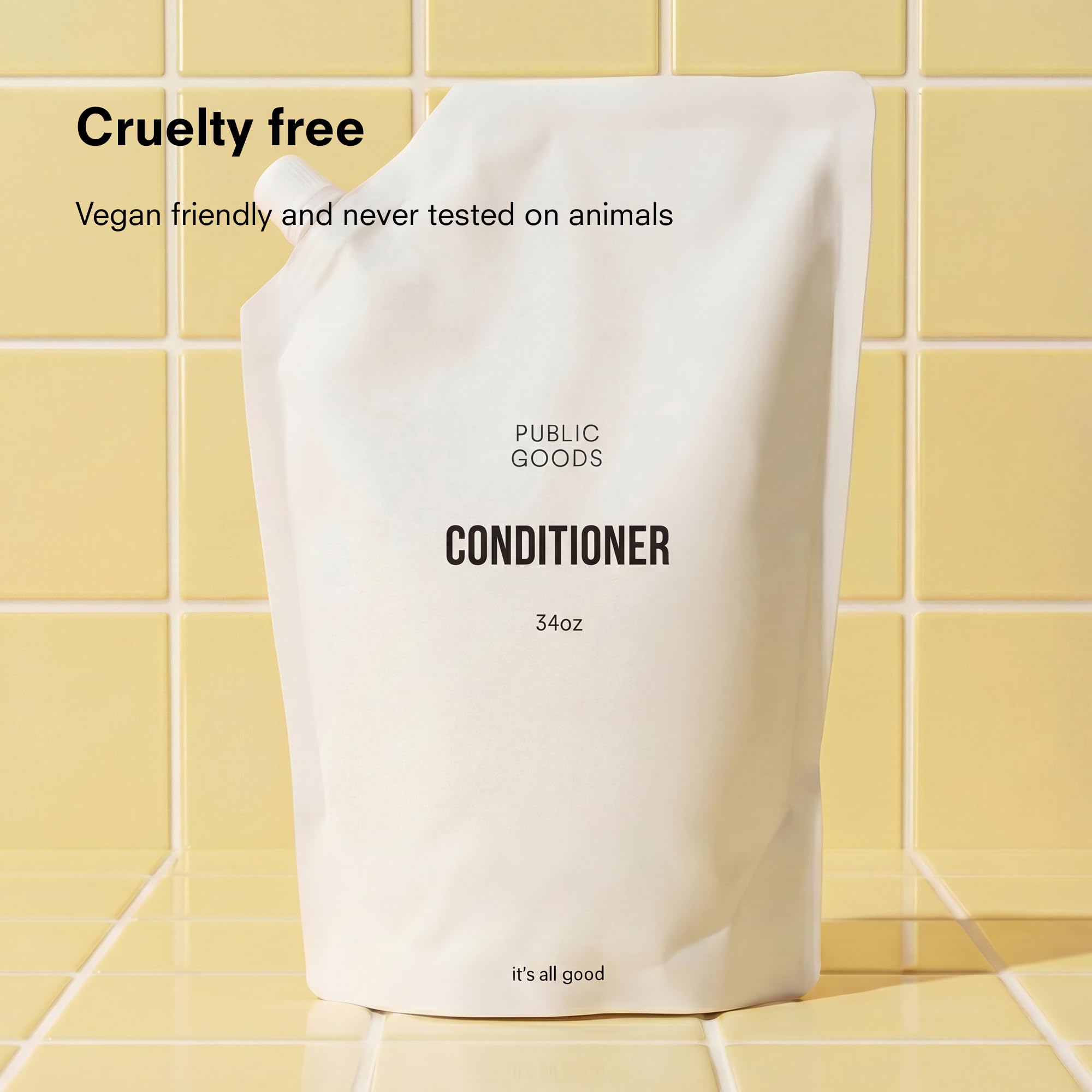 Public Goods conditioner texture pouring from bottle showing creamy consistency and hydration