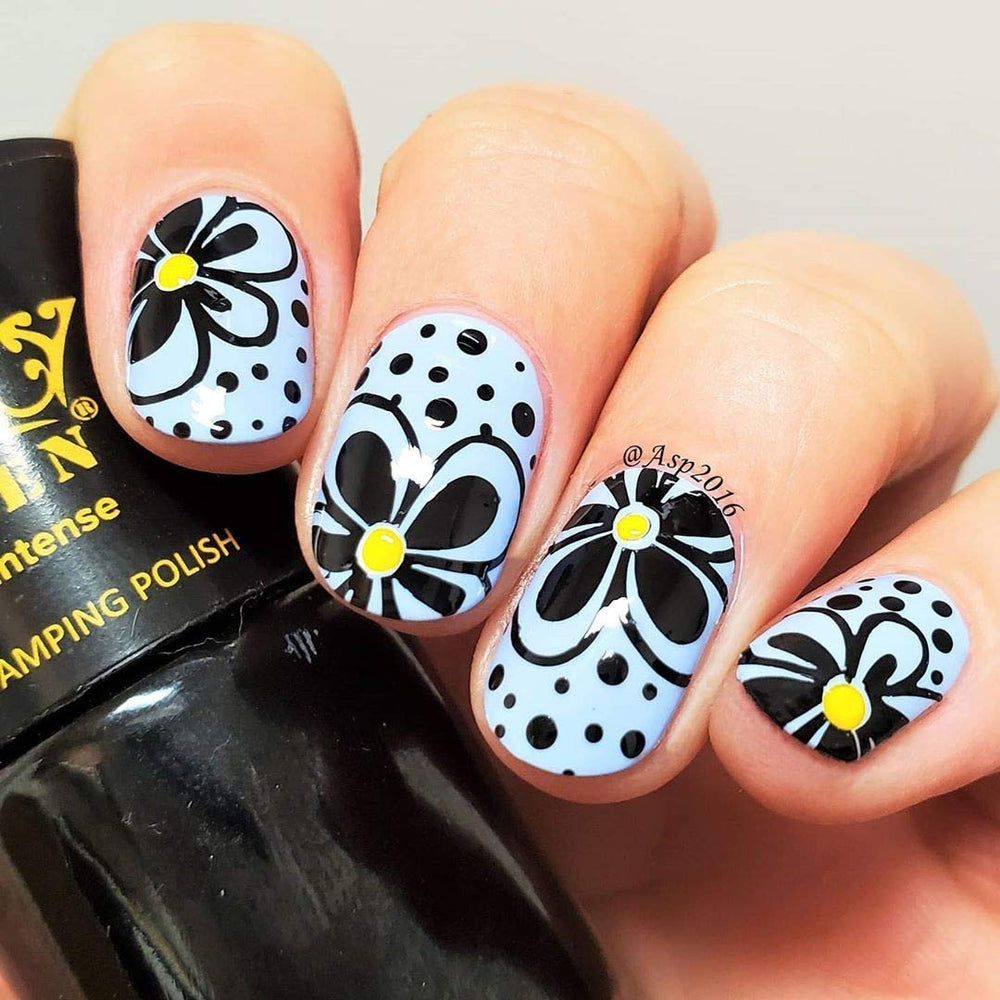 PUEEN nail art in use: stamped monochrome design on nails showcasing sharp contrast