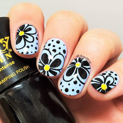 PUEEN nail art in use: stamped monochrome design on nails showcasing sharp contrast
