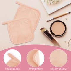 Puomue cloth held in hand showing 6x6 inch scale for travel convenience