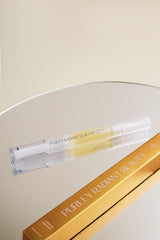 Purely Radiant nail oil on vanity with manicure tools showing everyday use