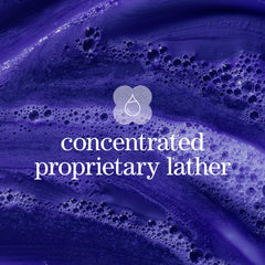 Pureology bottle next to ruler to show compact 1.7 fl oz travel benefit