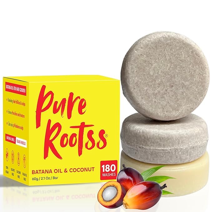 PureRootss front packaging of batana oil shampoo and conditioner set highlighting eco benefits