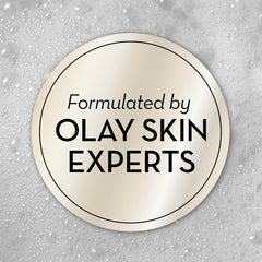 PURPUR Olay bottle in hand demonstrates compact 3 oz size ideal for carry-on convenience