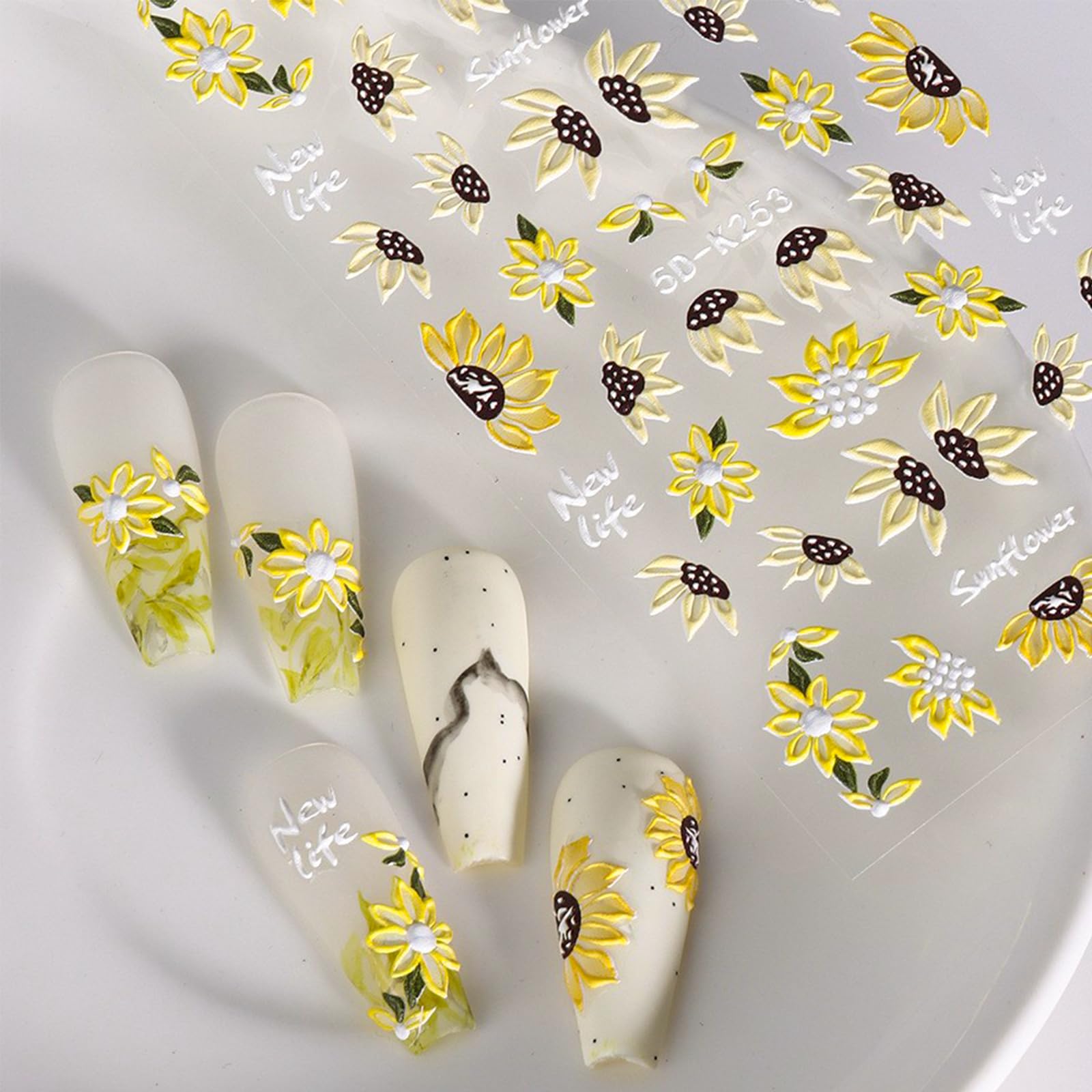 Puyokinm lifestyle shot of beach-ready manicure using sunflower stickers for seasonal styling