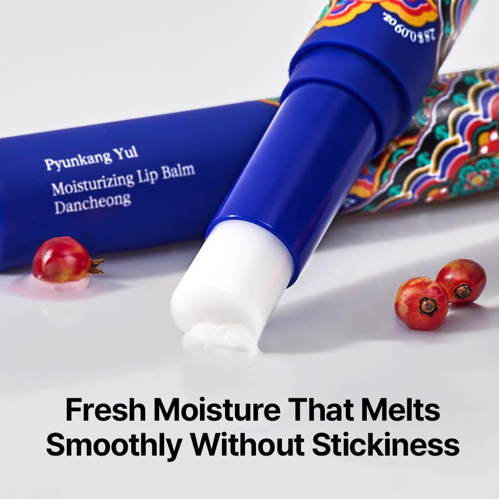 Pyunkang Yul lip balm beside rosehip oil bottle illustrating nourishing ingredients