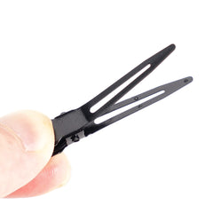 Qearl clip open position showing secure duckbill hold for styling