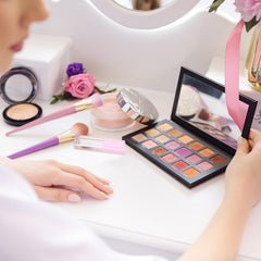 Qeuly lip gloss tubes in a purse to show travel-ready, on-the-go benefit