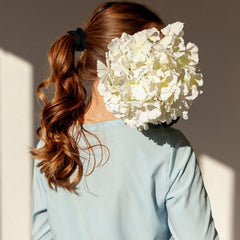 QFGasre paired with outfit in lifestyle shot for an elegant accessorizing idea